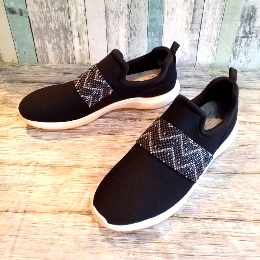 Black Slip-On Sneakers with Patterned Strap fit more like a narrow 10